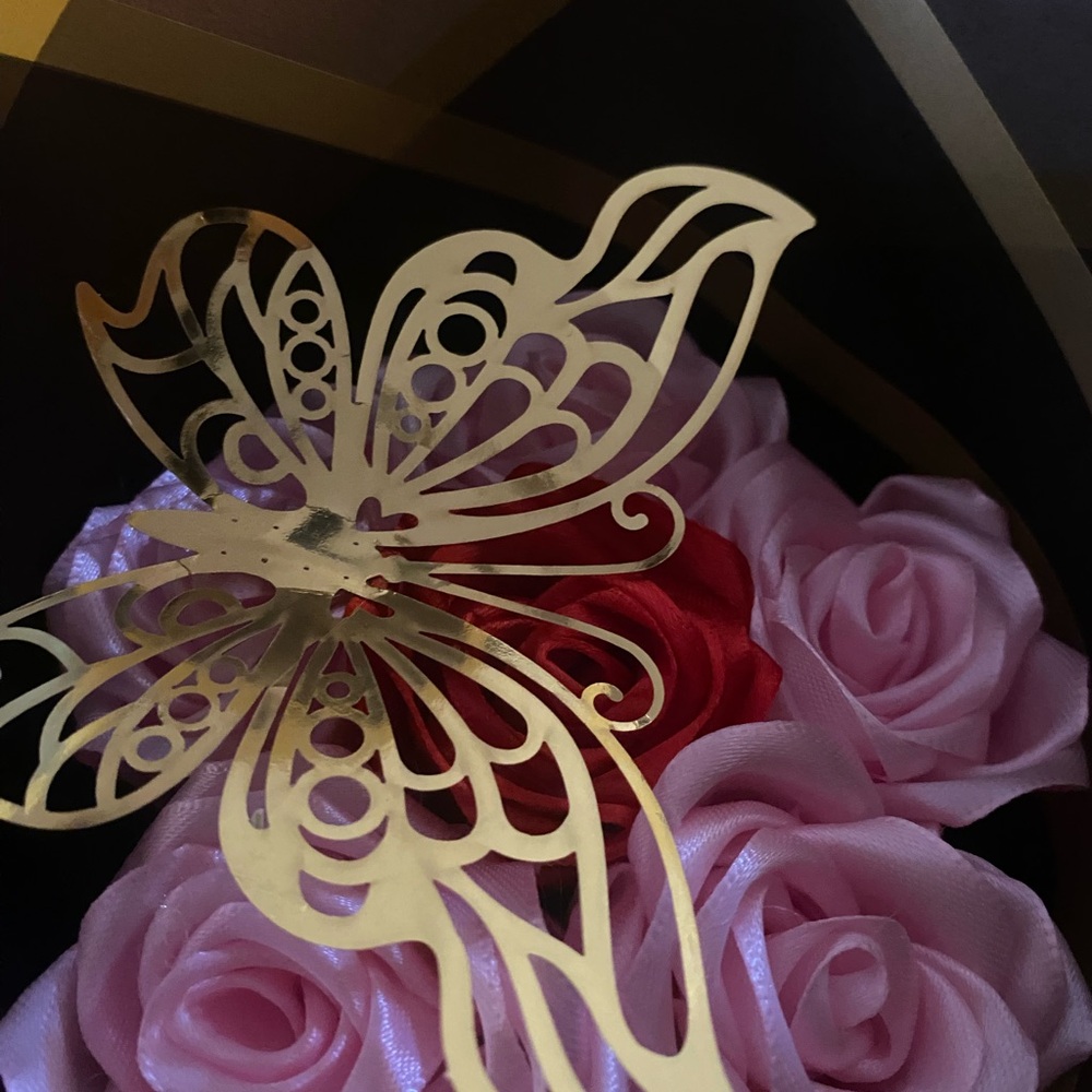 Gold Butterfly with Pink and Red Roses .